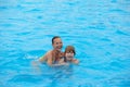 Happy little girls have fun swimming in the pool. Wonderful mood Royalty Free Stock Photo