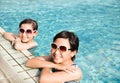 Happy little girls having fun in swimming pool Royalty Free Stock Photo