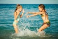 Happy little girls playing at the beach Royalty Free Stock Photo