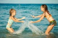 Happy little girls playing at the beach Royalty Free Stock Photo