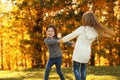 Happy little girls playing in park. Autumn walk Royalty Free Stock Photo