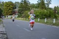 Happy little girls running in race on the street outdoors Royalty Free Stock Photo