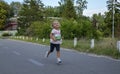 Happy little girls running in race on the street outdoors Royalty Free Stock Photo