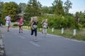 Happy little girls running in race on the street outdoors