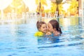 Happy little girls swimming in outdoor pool at sunset. Toned Royalty Free Stock Photo