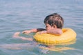 Happy little happy boy at sea