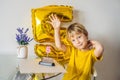 Happy little kid boy celebrating his birthday and blowing candles on homemade baked cake, indoor. Birthday party for Royalty Free Stock Photo