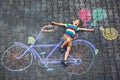 Little kid boy having fun with bike chalks picture Royalty Free Stock Photo