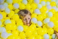 Happy little kid boy playing at colorful plastic balls playgroun Royalty Free Stock Photo