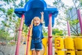 Happy little kid boy playing at colorful playground. Adorable child having fun outdoors Royalty Free Stock Photo