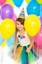 Happy little kid girl with colorful balloons on Royalty Free Stock Photo