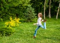 Happy little kid girl jumping on the summer meadow Royalty Free Stock Photo