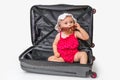 Happy little kid inside suitcase isolated on white