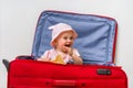 Happy little kid inside suitcase