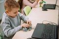 happy little kid making diy robot, stem Royalty Free Stock Photo