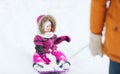 Happy little kid on sled outdoors in winter Royalty Free Stock Photo