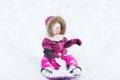 Happy little kid on sled outdoors in winter Royalty Free Stock Photo