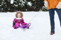 Happy little kid on sled outdoors in winter Royalty Free Stock Photo