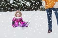 Happy little kid on sled outdoors in winter Royalty Free Stock Photo