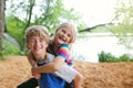 Happy Little Kids Playing Together on Beach by Lake Royalty Free Stock Photo