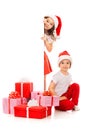 Happy little kids in Santa hat peeking from behind Royalty Free Stock Photo