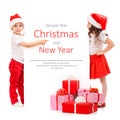 Happy little kids in Santa hat peeking from behind Royalty Free Stock Photo