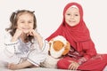 Happy little Muslim girls playing with sheep toy - celebrating E Royalty Free Stock Photo