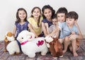 Happy little Muslim kids playing with sheep toys