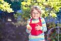 Happy little preschool kid boy with glasses, books, apple and backpack on his first day to school or nursery. Funny Royalty Free Stock Photo