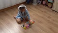 Happy Little Preschool Toothless Girl Playing With Colored Wooden Toy. Kids Learn To Count By Playing Teaches Numbers At Royalty Free Stock Photo