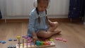 Happy Little Preschool Toothless Girl Playing With Colored Wooden Toy. Kids Learn To Count By Playing Teaches Numbers At Royalty Free Stock Photo