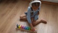 Happy Little Preschool Toothless Girl Playing With Colored Wooden Toy. Kids Learn To Count By Playing Teaches Numbers At Royalty Free Stock Photo