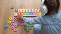 Happy Little Preschool Toothless Girl Playing With Colored Wooden Toy. Kids Learn To Count By Playing Teaches Numbers At Royalty Free Stock Photo