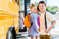 happy little pupils entering school bus Royalty Free Stock Photo