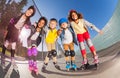 Happy little roller-skaters having fun outdoors Royalty Free Stock Photo