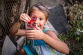Happy little rural girl with a spinner