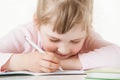 Happy little school girl learning to write Royalty Free Stock Photo