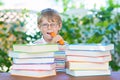 Happy little schoolboy with glasses and books Royalty Free Stock Photo