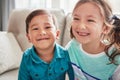 Happy little siblings. Portrait of two happy little siblings at home. Royalty Free Stock Photo