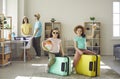 Happy little sisters sitting on travel suitcase prepared for summer vacation Royalty Free Stock Photo