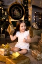 Little smiling girl with christmas gift box. Royalty Free Stock Photo