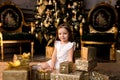 Little smiling girl with christmas gift box. Royalty Free Stock Photo