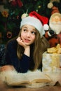 Happy little smiling girl  with old book is waiting for Christmas Royalty Free Stock Photo