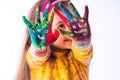 Happy little student girl showing painted hands - childhood and drawing concept, education and art Royalty Free Stock Photo