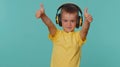 Happy little toddler children boy listening music via headphones, dancing disco, fooling, having fun Royalty Free Stock Photo