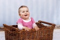 Happy little toddler laughing in the basket Royalty Free Stock Photo