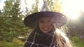 Happy little witch smiling at camera, children entertainment center, Halloween