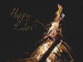 Happy Lohri written on a huge bonfire with copy space for text. Punjabi Lohri festive celebration
