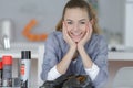 Happy long-haired girl cleaning shoes at home Royalty Free Stock Photo