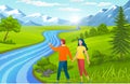 Happy in love couple holding hands and walking near river, man show mountains to girl, summertime Royalty Free Stock Photo